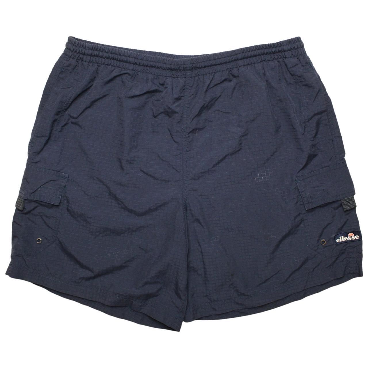 Navy Ellesse cargo style shorts. Nice materials and... - Depop