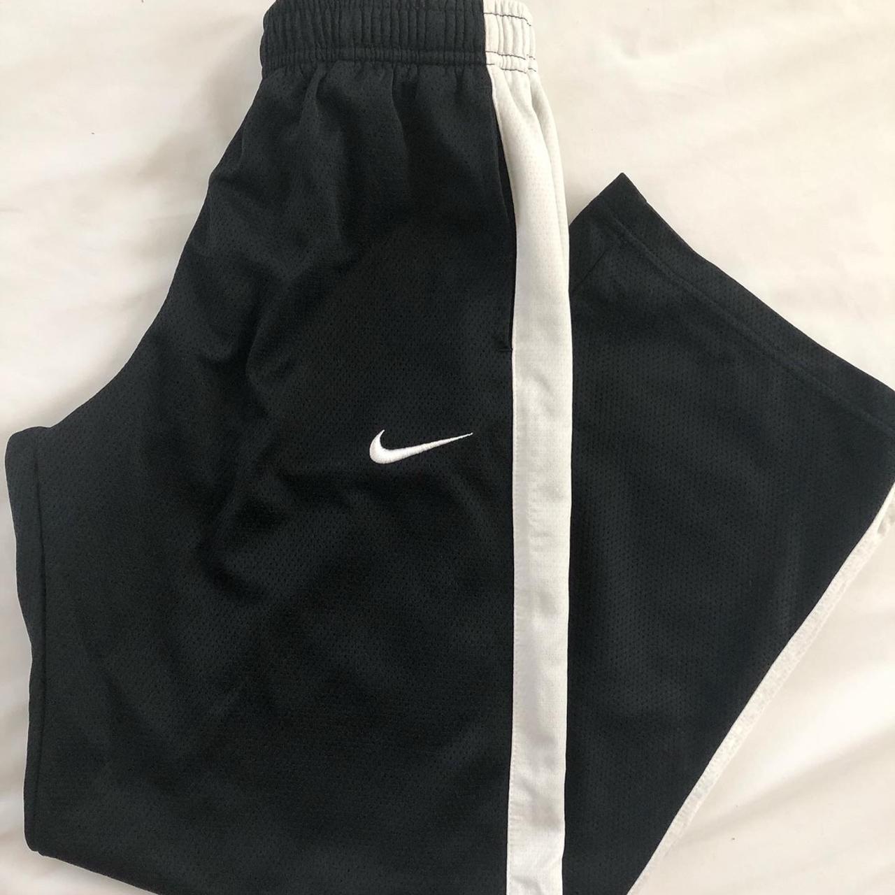 black nike pants with white stripe