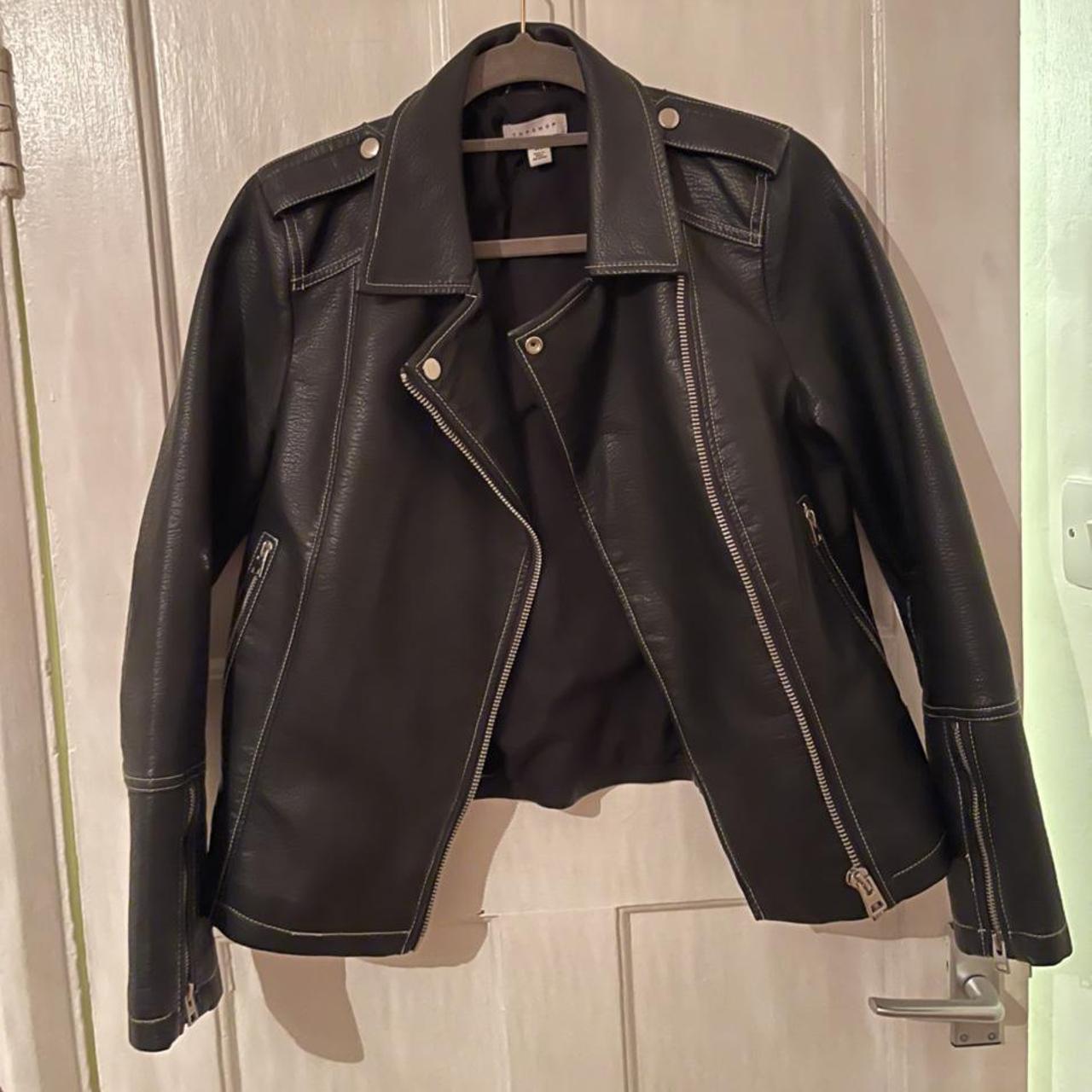 black leather jacket with white stitching