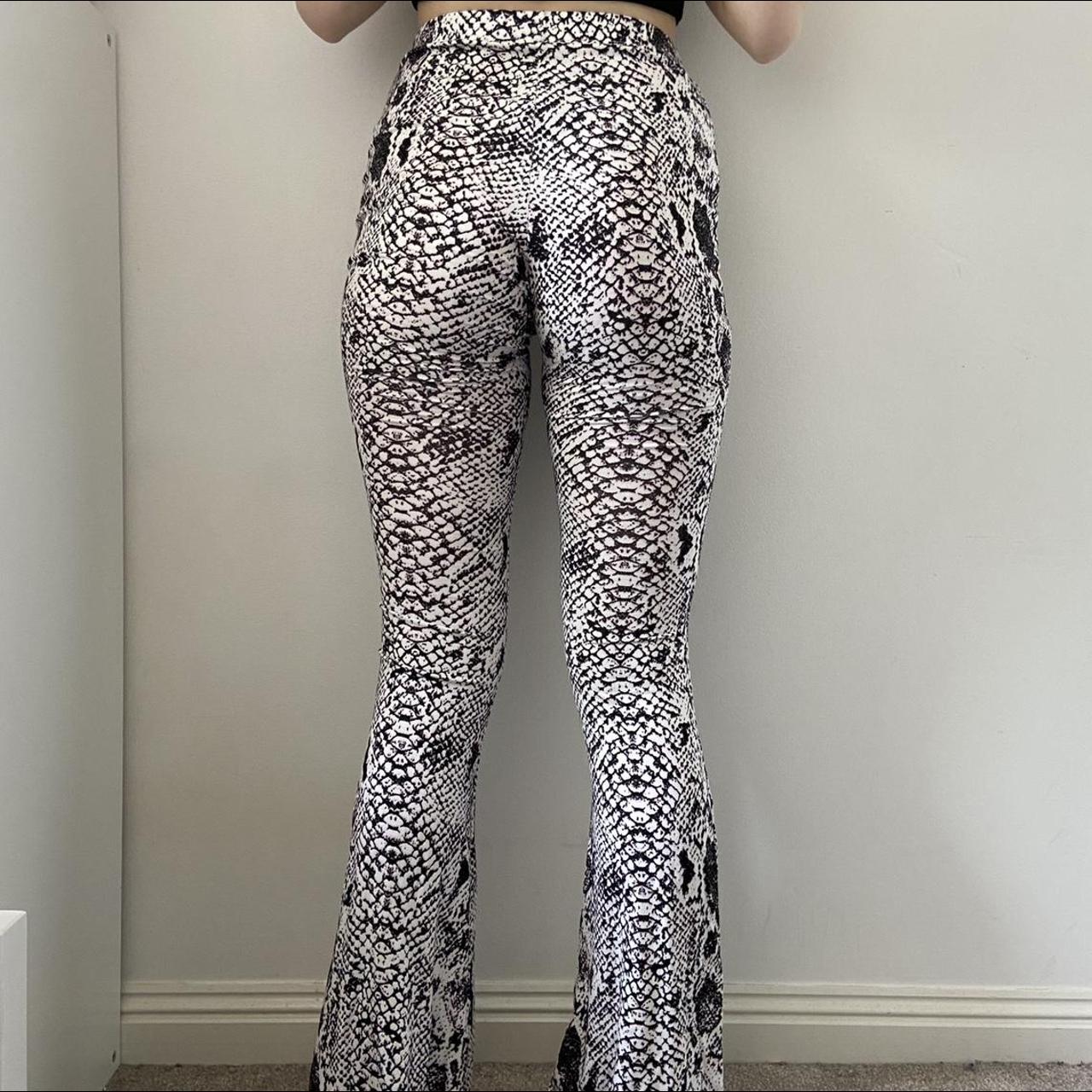 High waisted snake skin print flares Label Size:... - Depop