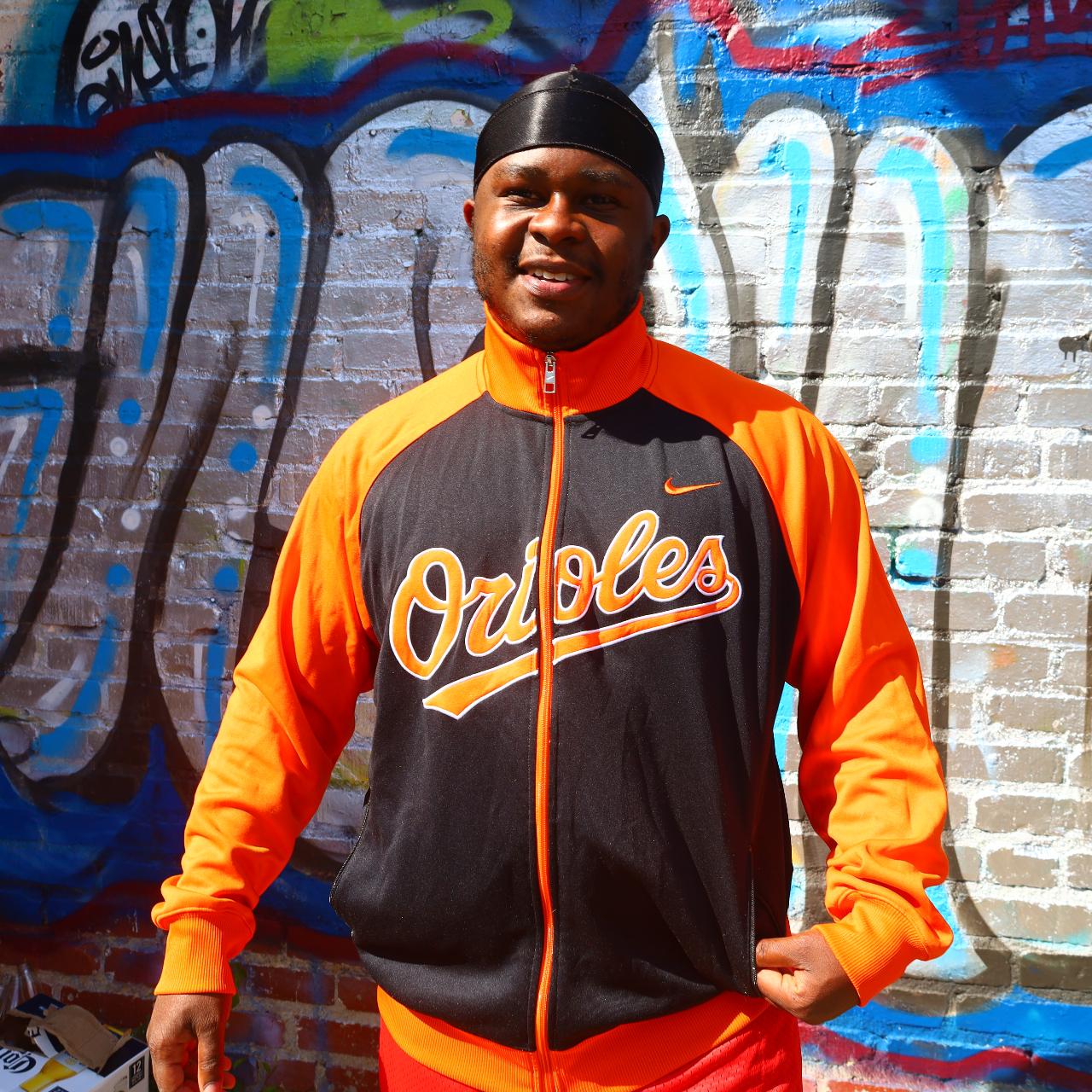 Black and best sale orange nike jacket