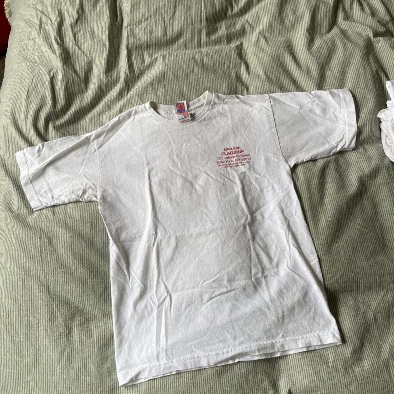 Glossier NY Flagship Tee Wear is visible,... - Depop