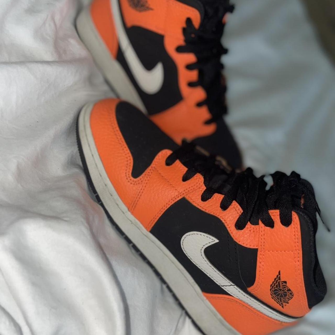 new orange and black jordans