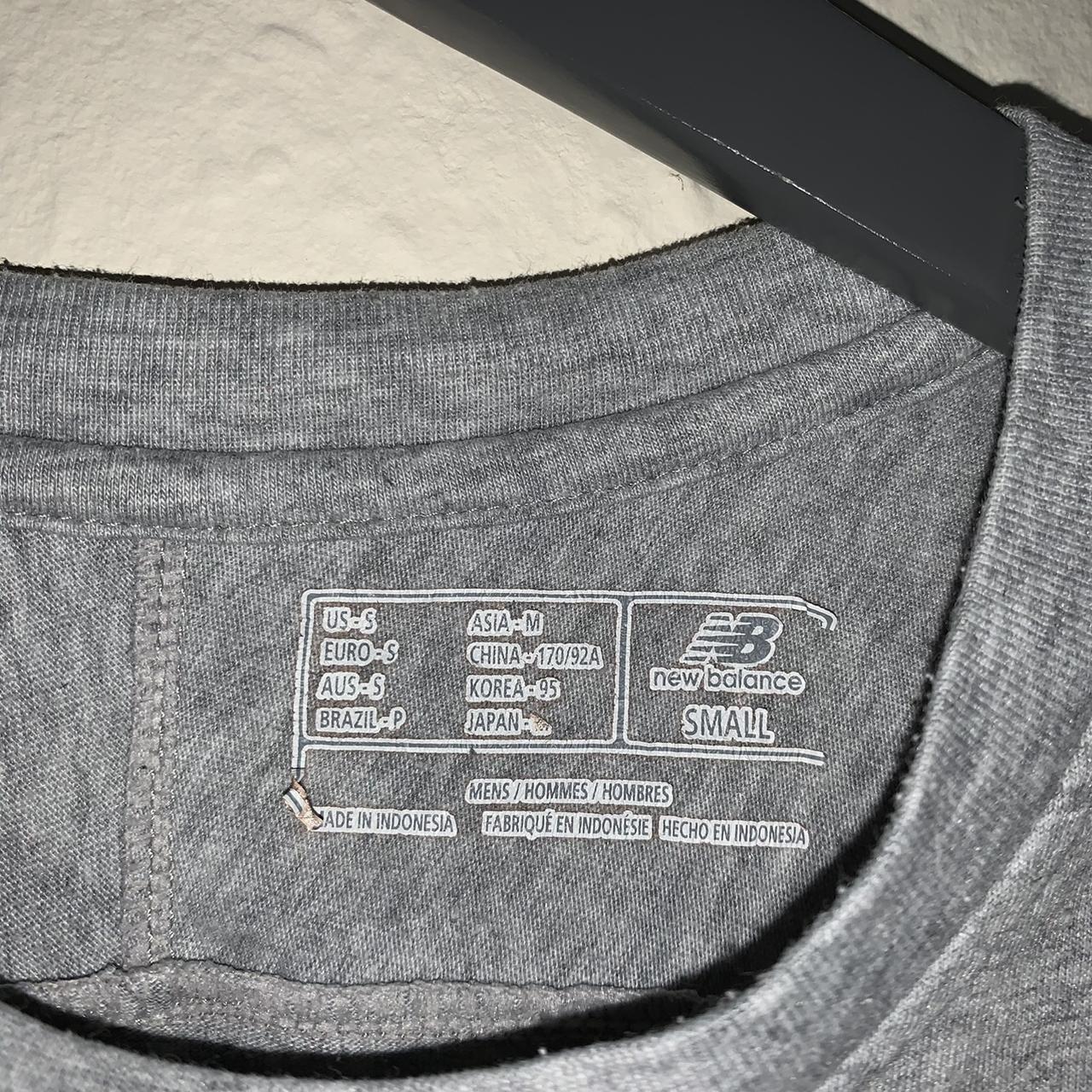 About- Fire new balance tee in grey, with a patch... - Depop