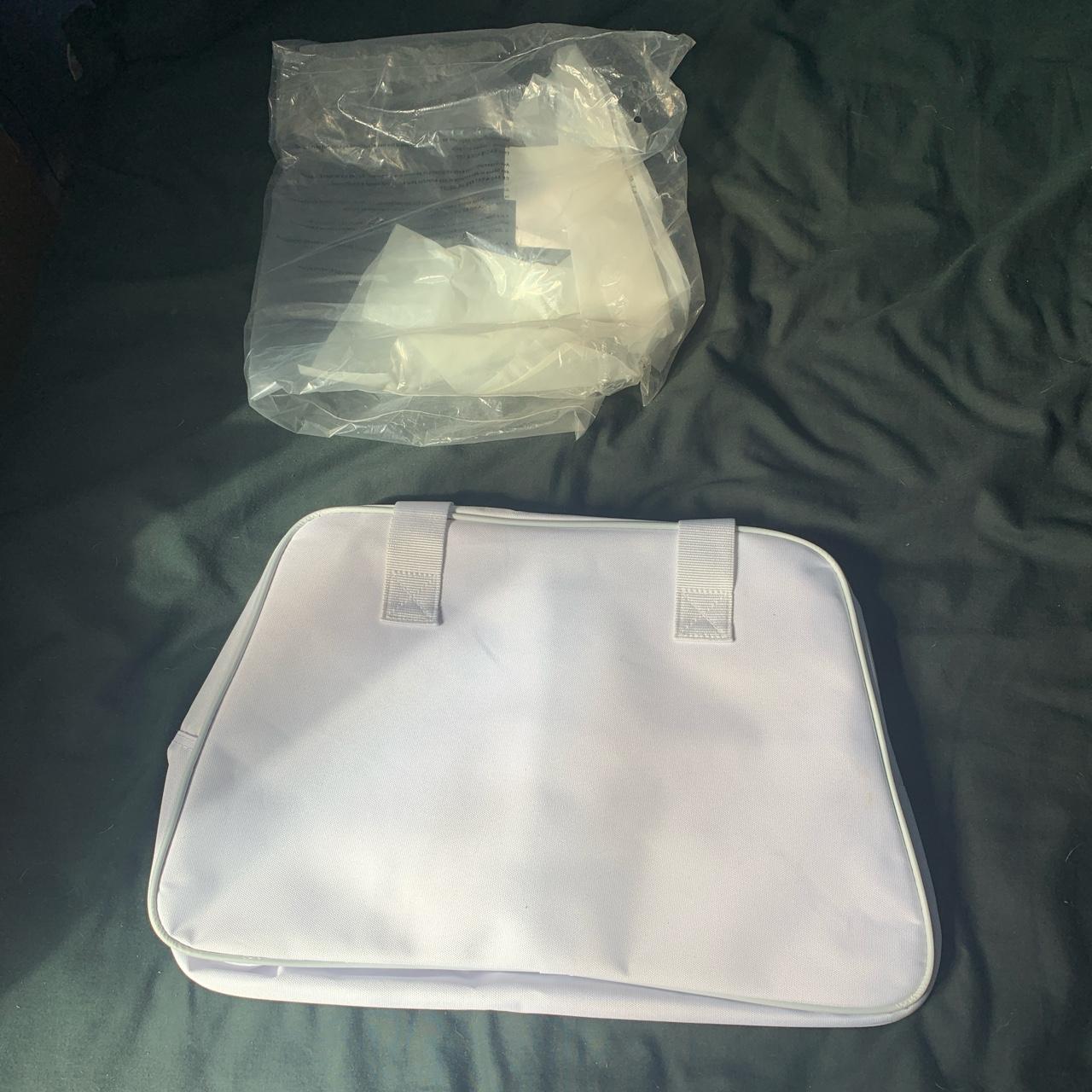 Lacoste best sale perfume bag