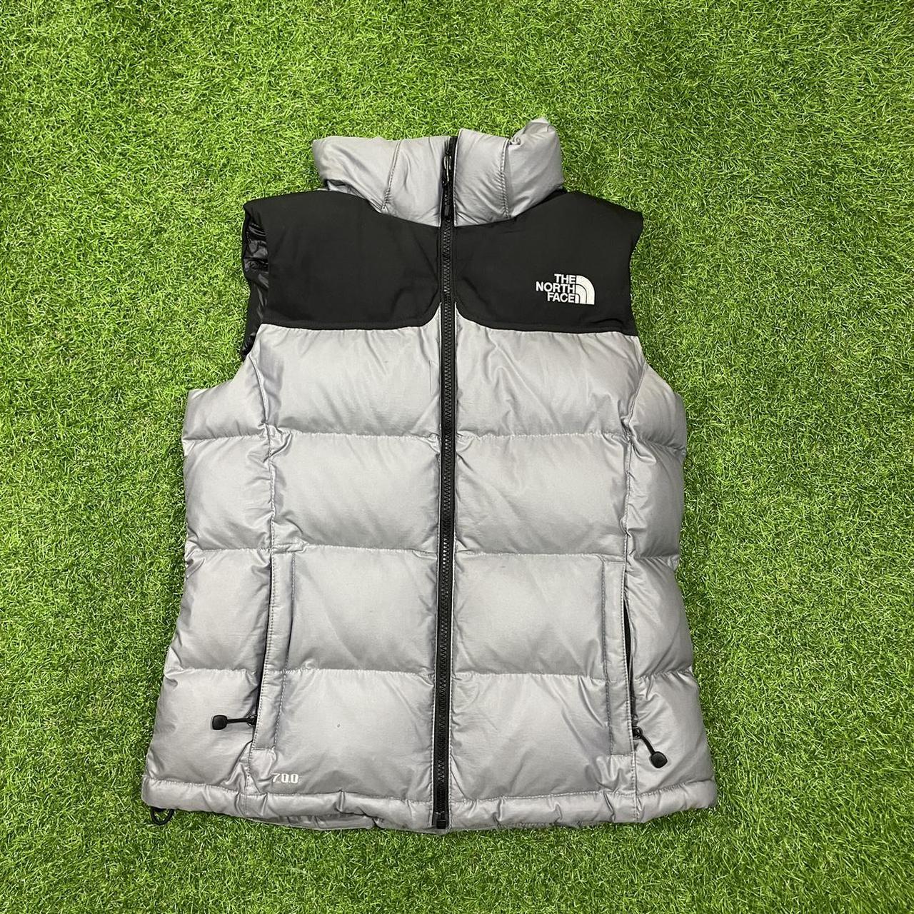 silver north face vest