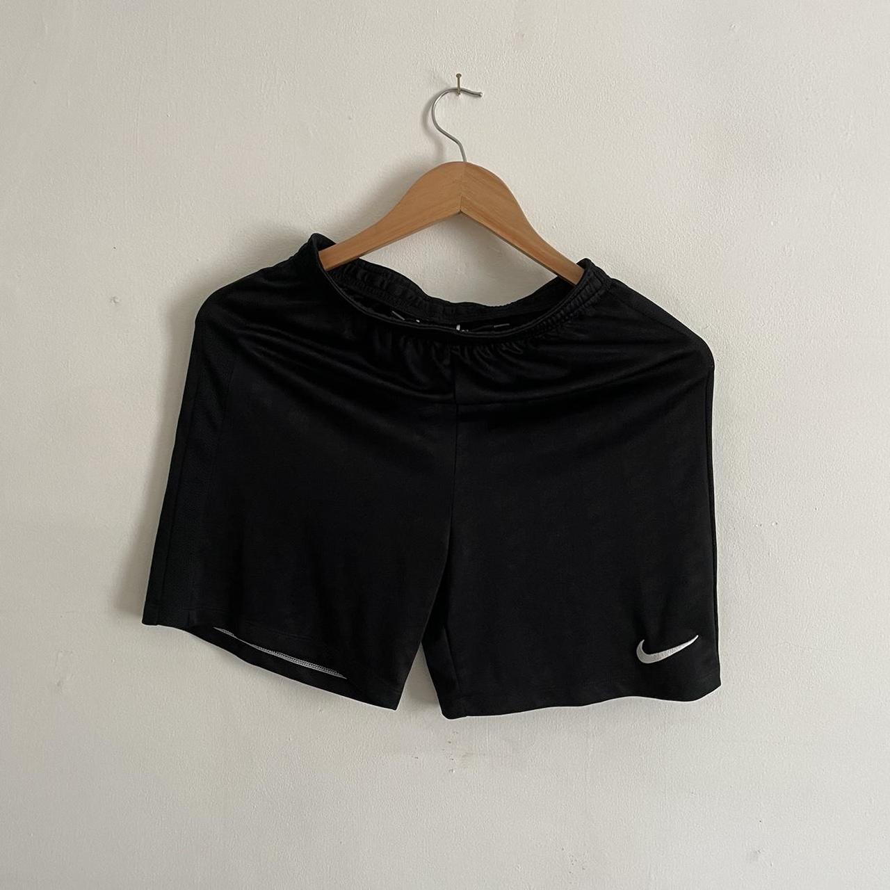 Black Nike sport shorts. Kids L, would fit a small... - Depop