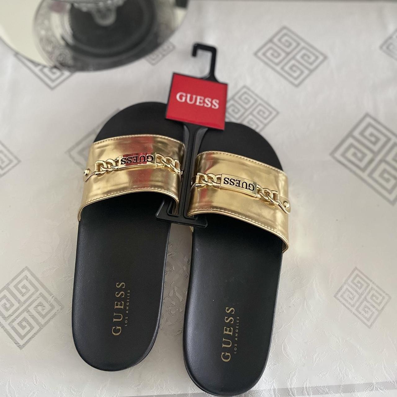 Guess Women's Black and Gold Slides | Depop