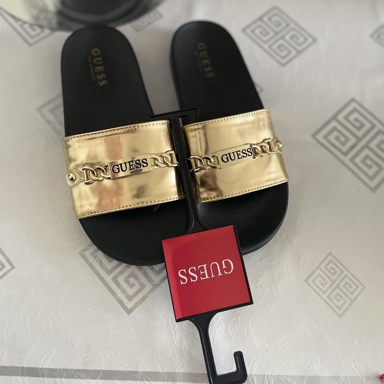 Guess Women's Black and Gold Slides | Depop