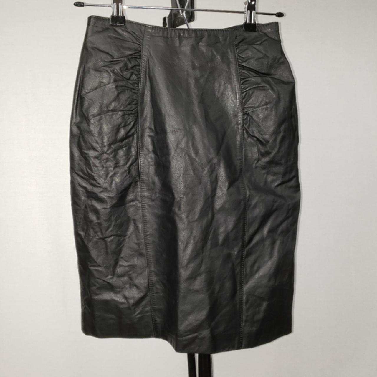 This vintage Chia leather skirt is body-hugging... - Depop