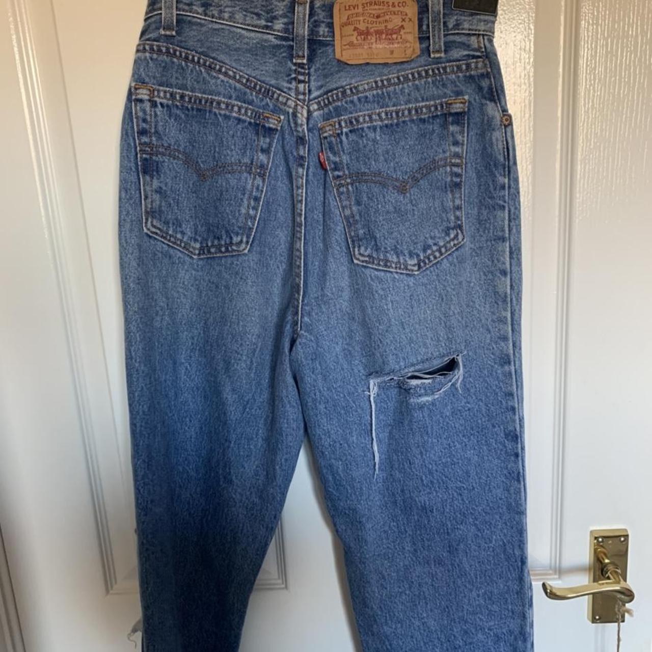 vintage Levi denim mom jeans with rips and pattern... - Depop
