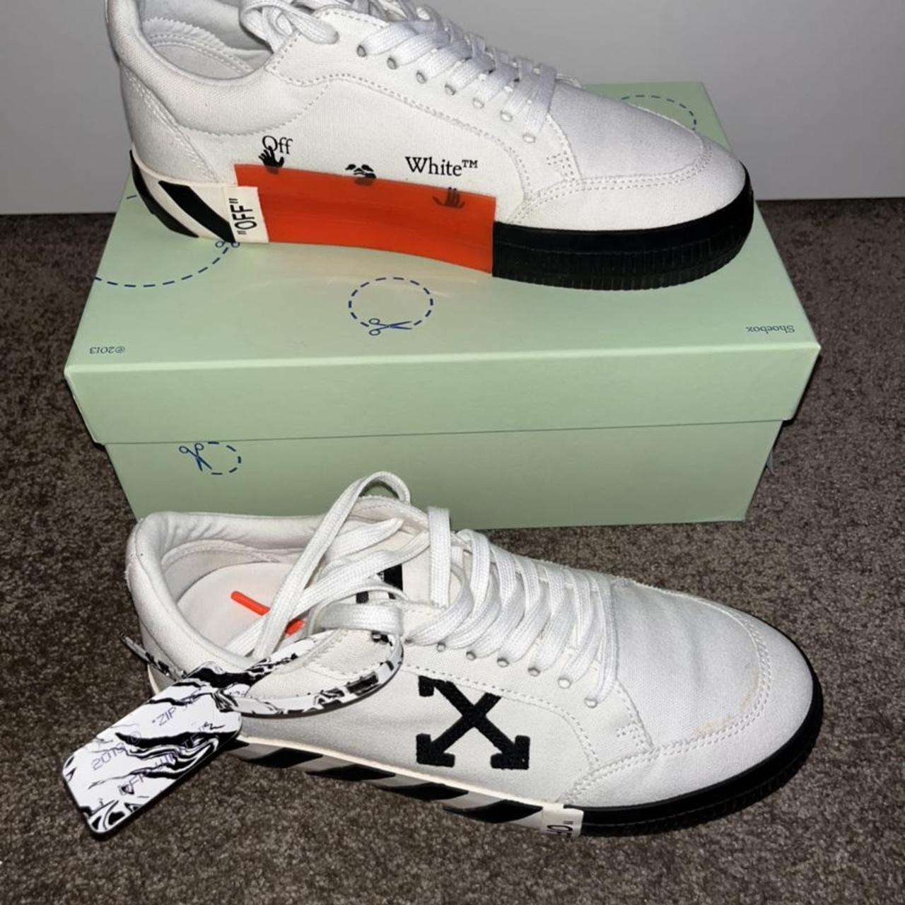 White and black Off-White low-top Vulcanized... - Depop