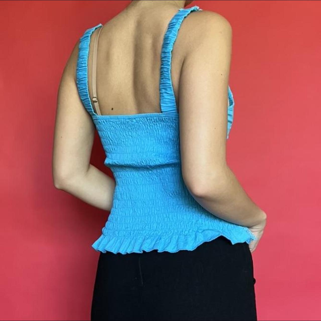 Stunning vintage blue corset top. Ruffled lace hem... Depop