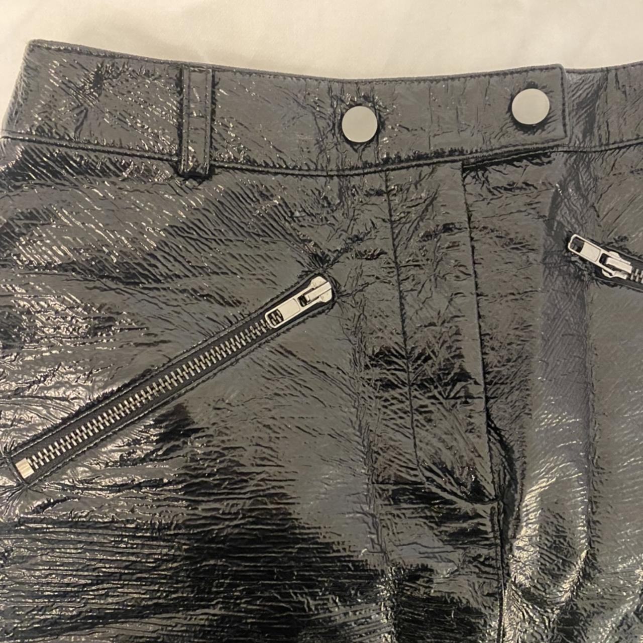 Black faux leather mini skirt, with silver front zip... - Depop