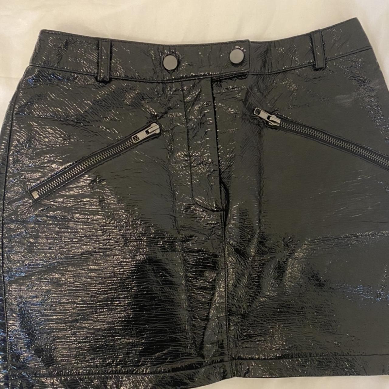 Black faux leather mini skirt, with silver front zip... - Depop