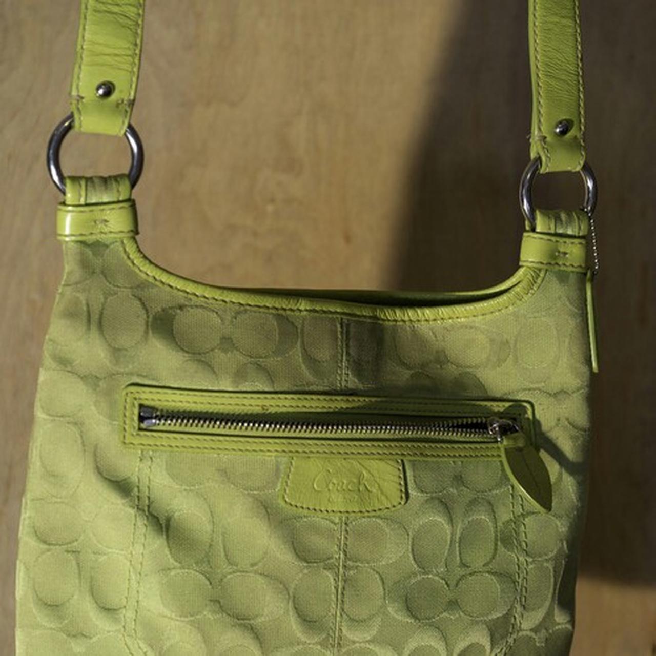 Lime green Coach purse. Slight signs of wear from