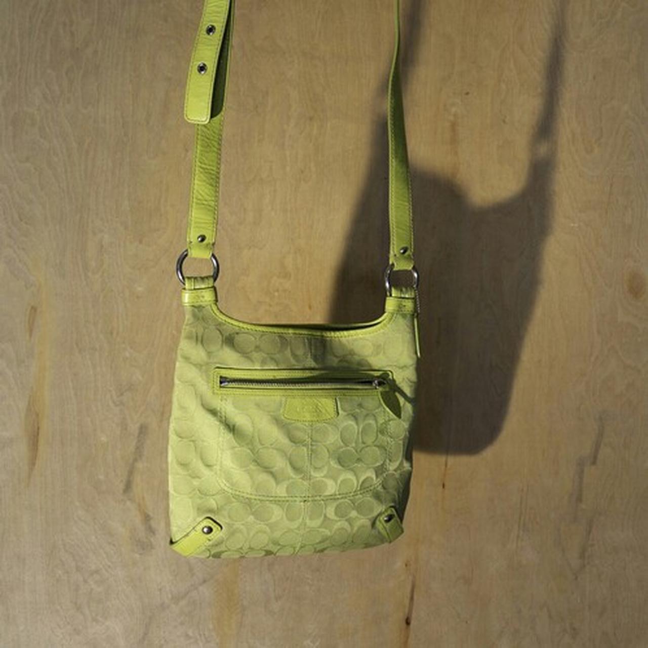 Lime green Coach purse. Slight signs of wear from