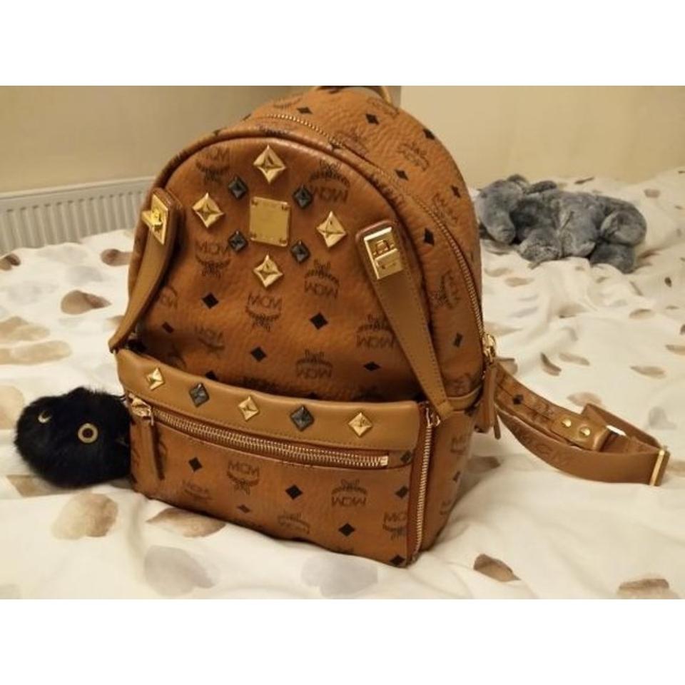 Pink/Gold MCM backpack, signs of wear evident inside - Depop