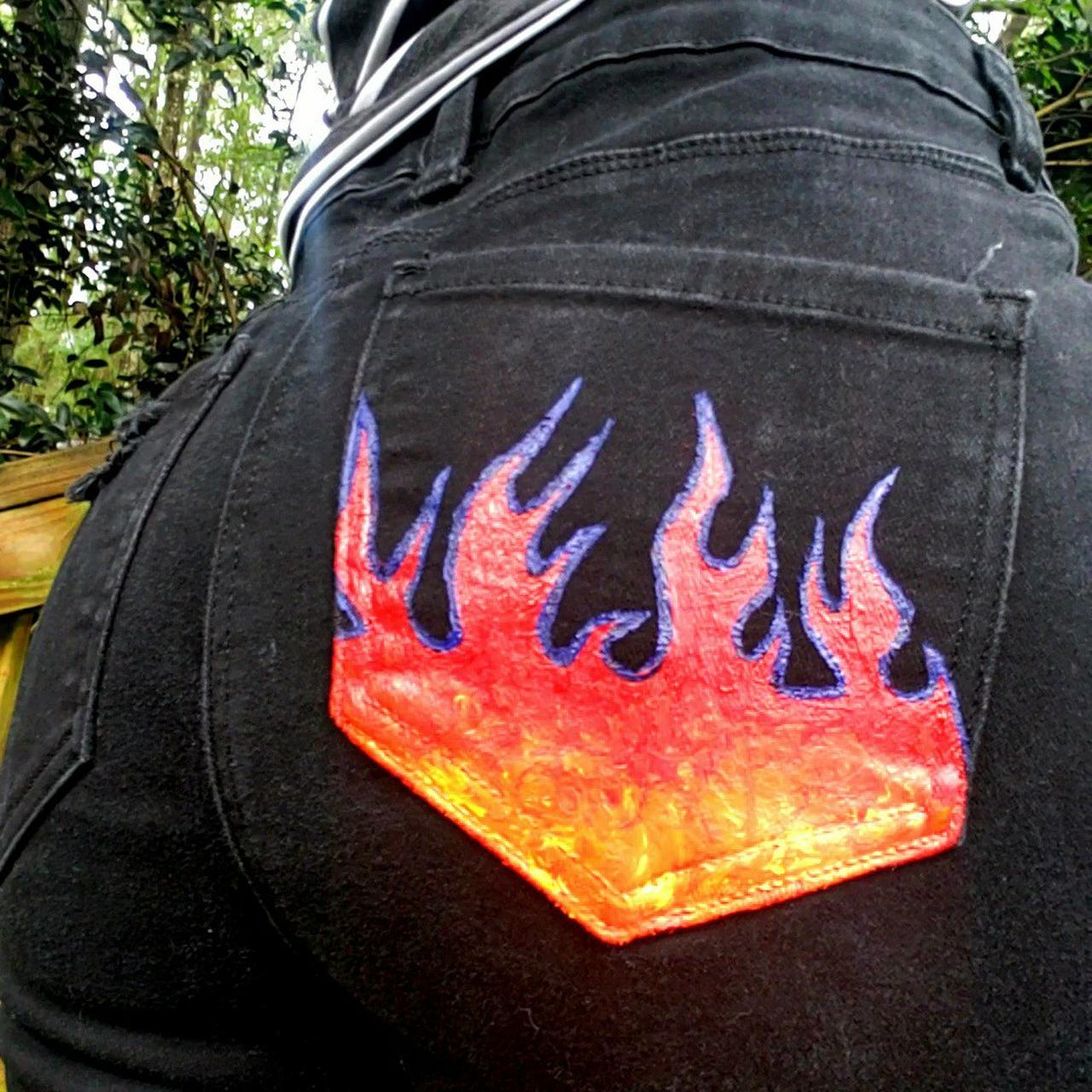 Flame painted store jeans