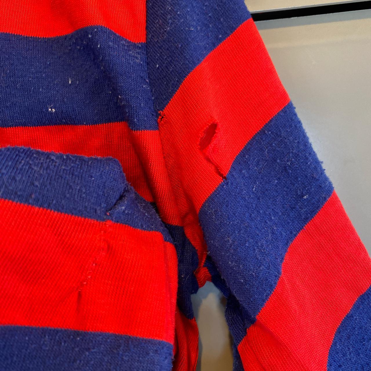 This men's red and blue striped polo shirt is... - Depop