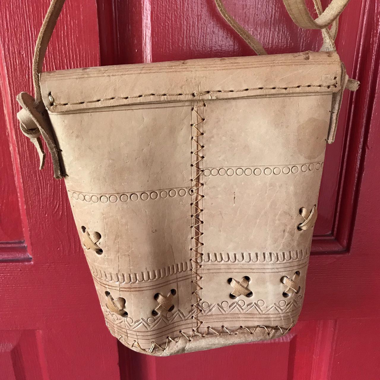 Tan hard leather purse. Feels very 80s to me. The... Depop