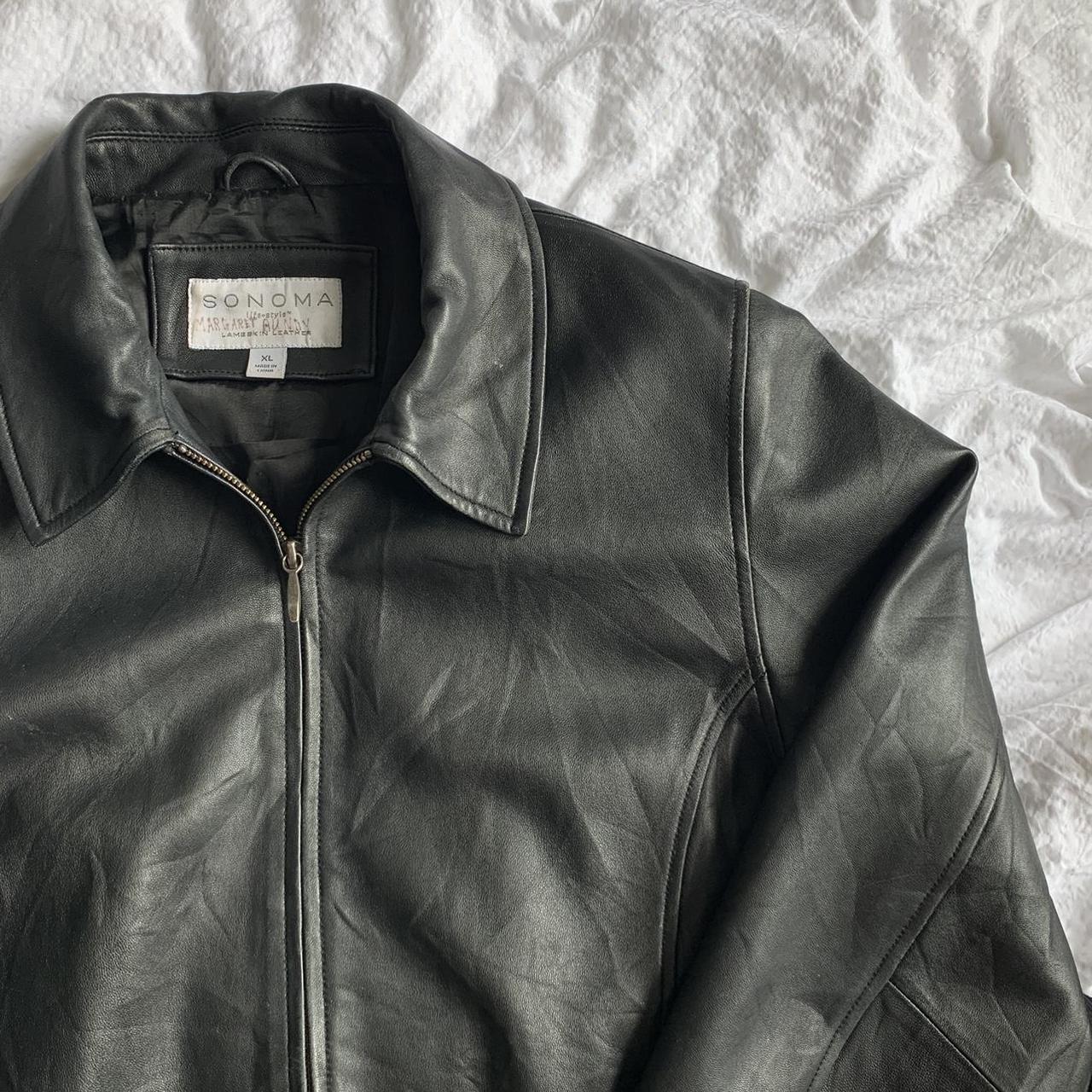 black genuine leather zip up biker jacket, size XL...
