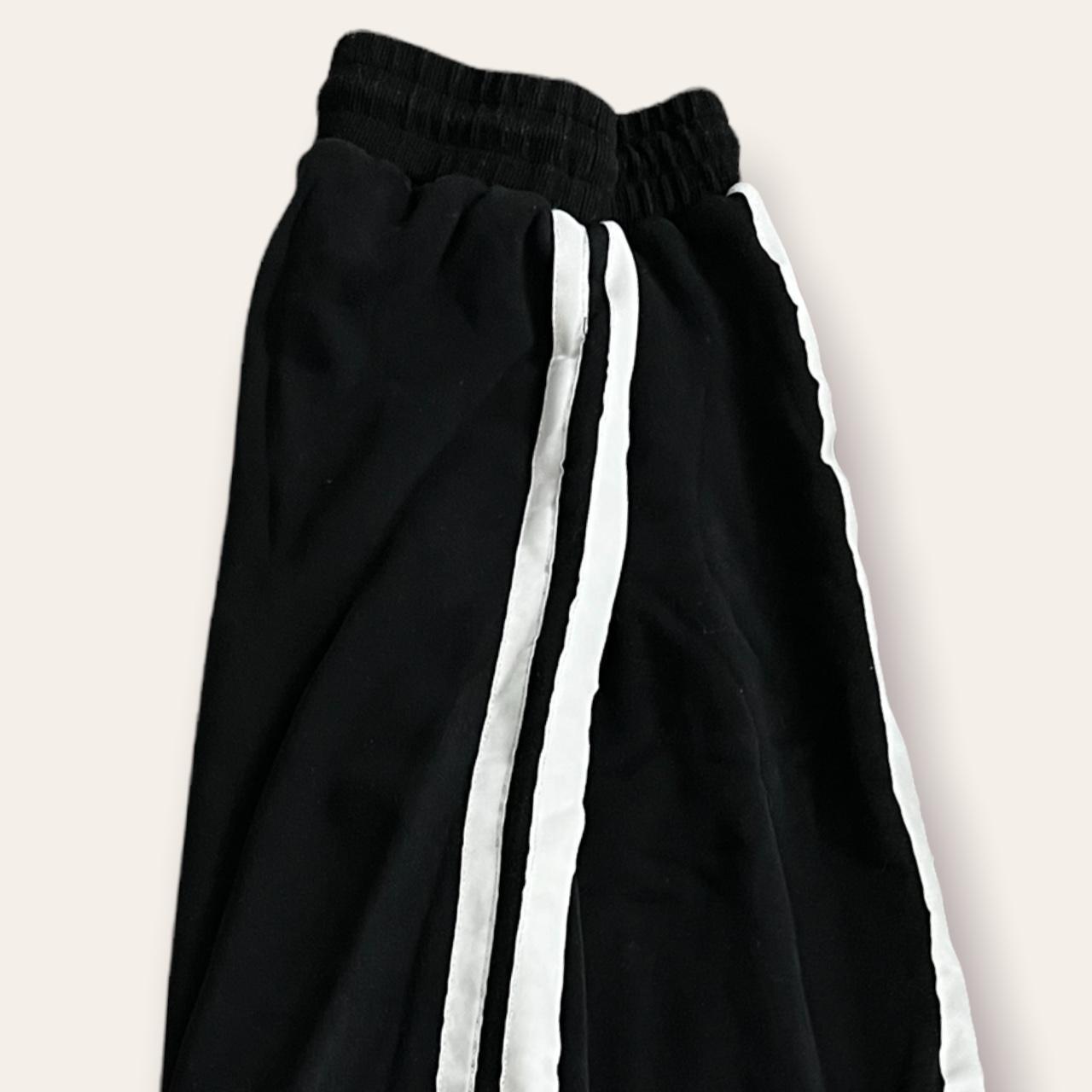 I.AM.GIA black sweatpants with white stripes size... - Depop