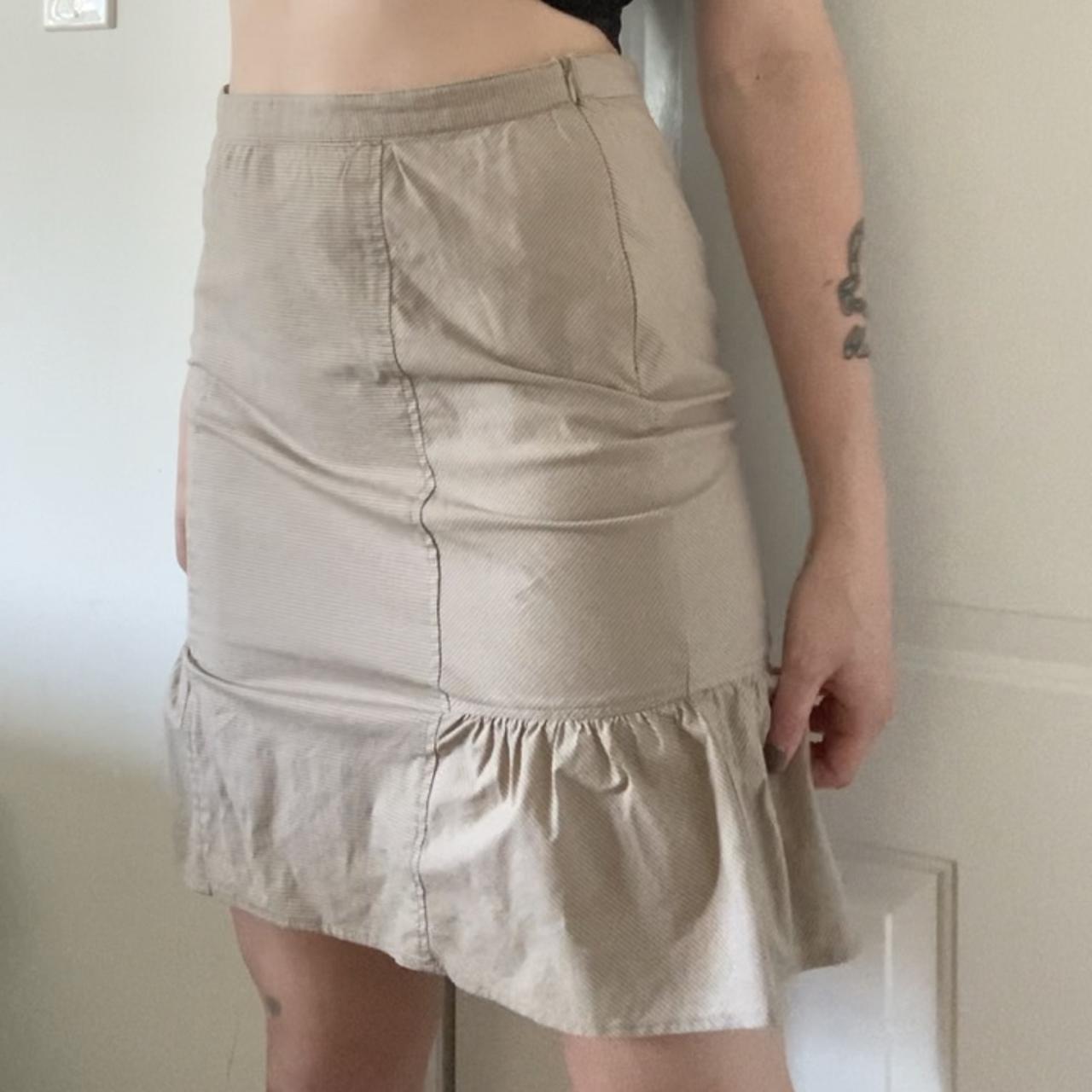 beige mini ish skirt. i don’t know the style.... - Depop