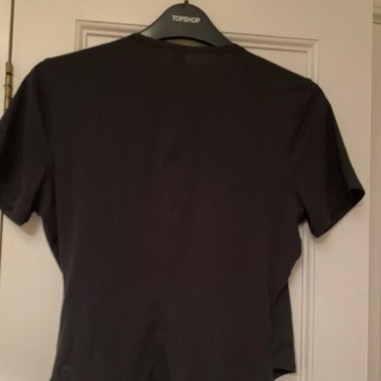 Lululemon black cross front short sleeved T-shirt.