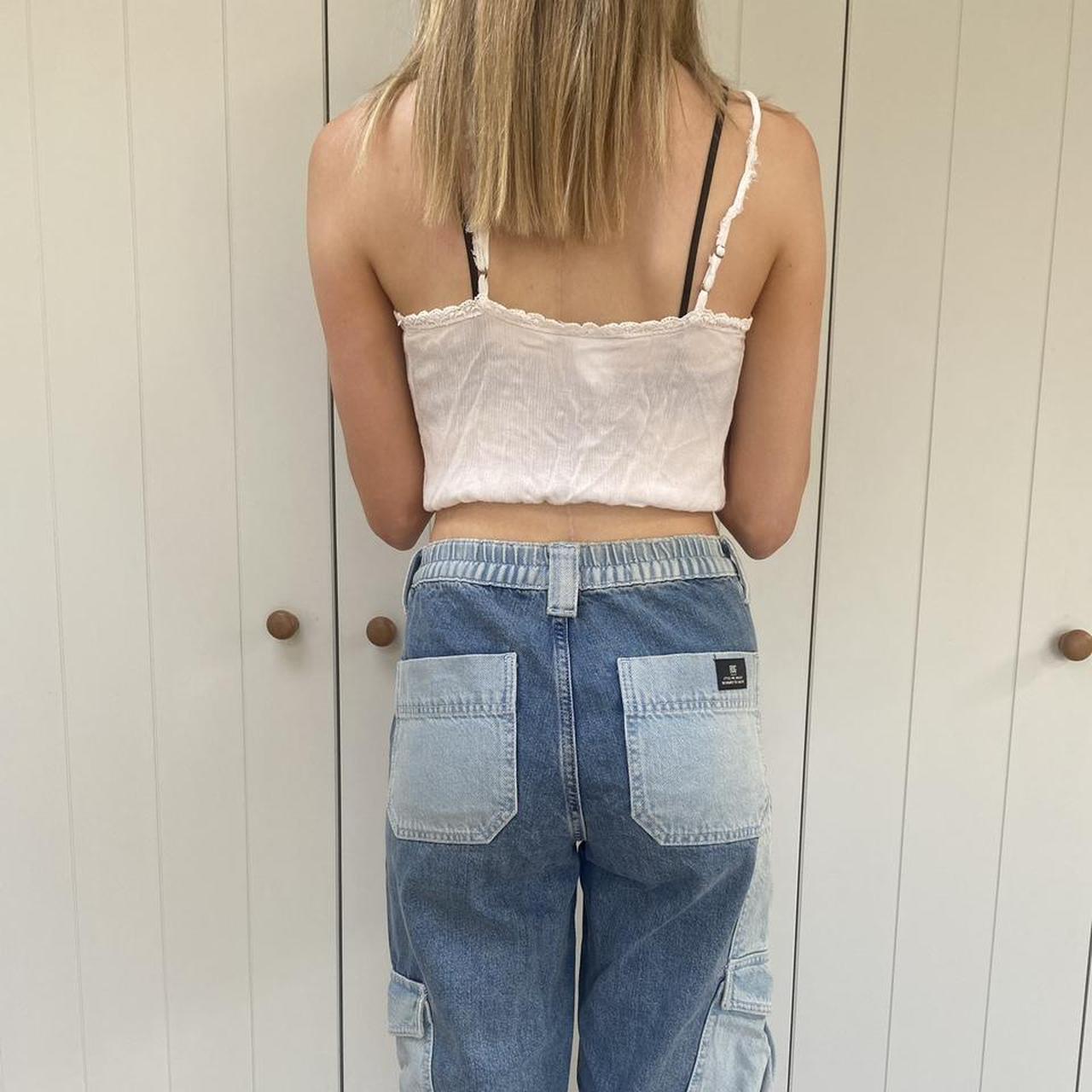 Brandy Melville white cross over cami with a lace... Depop