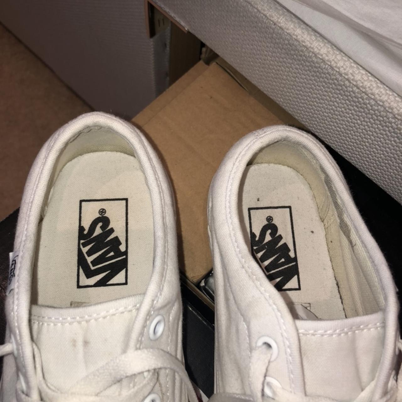 All white VANS. Size 4. Worn with a few