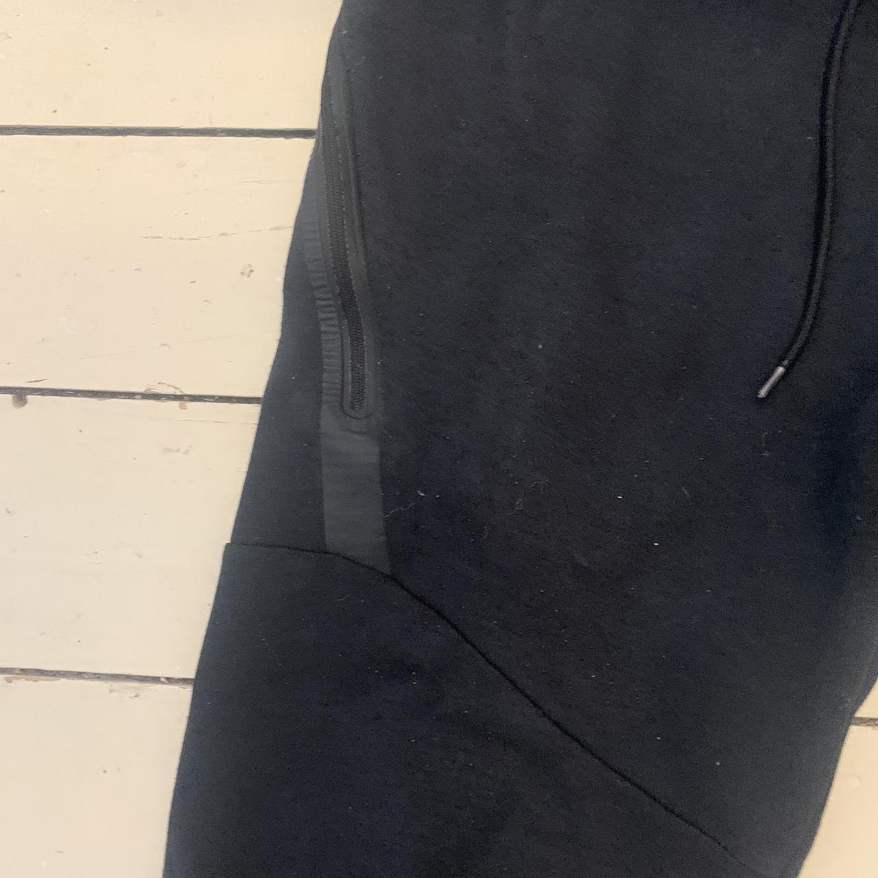 Black Nike tech bottoms Some wear and tear on... - Depop