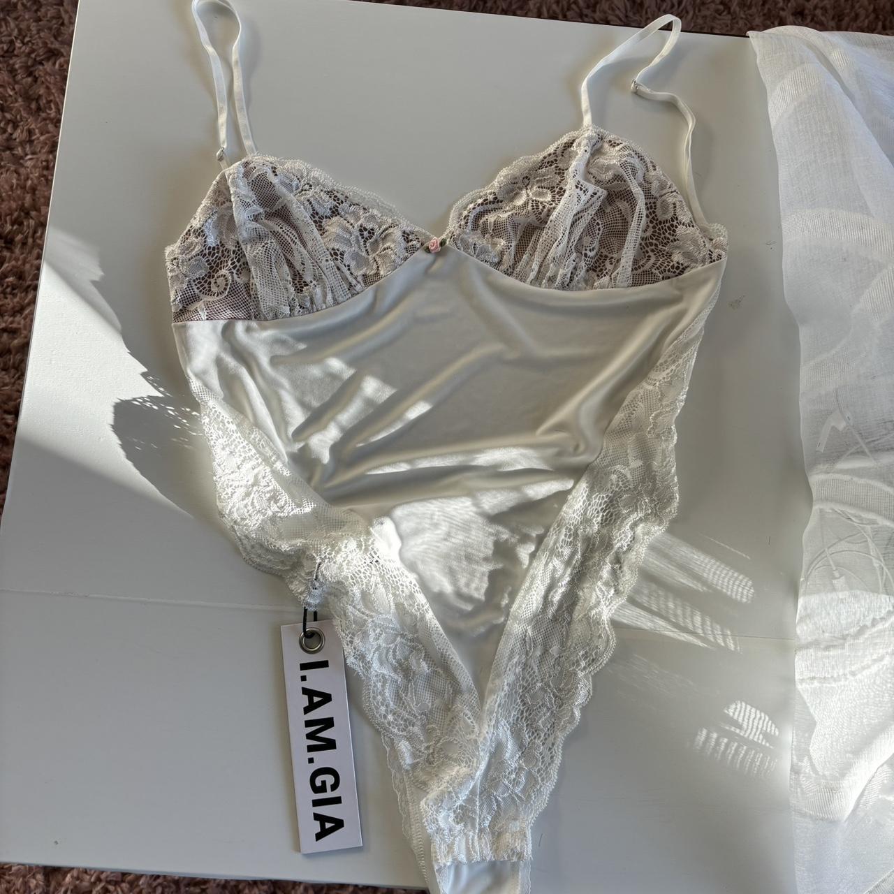 I am gia bodysuit Never worn Size medium Karissa... - Depop