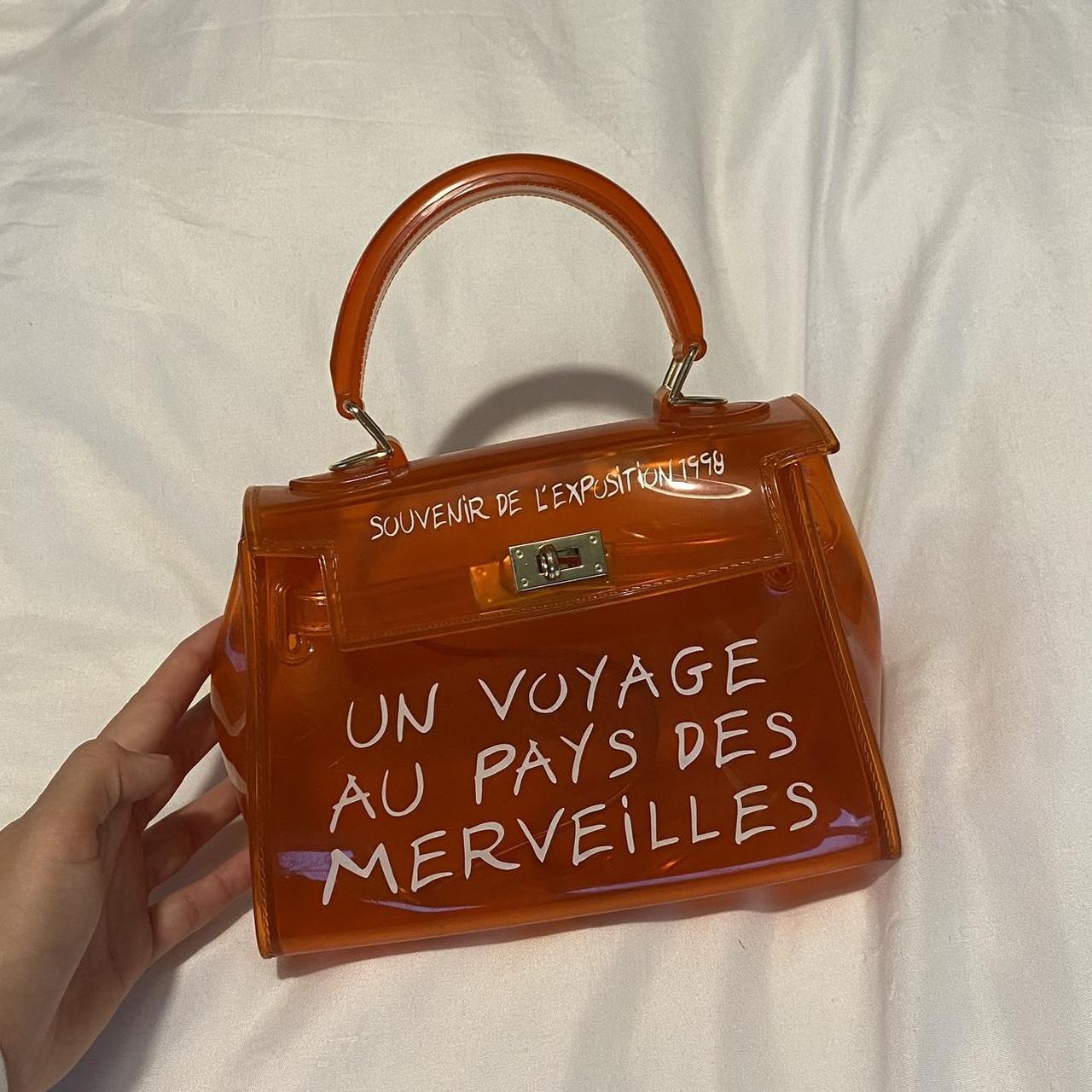 Un voyage 2025 bag orange