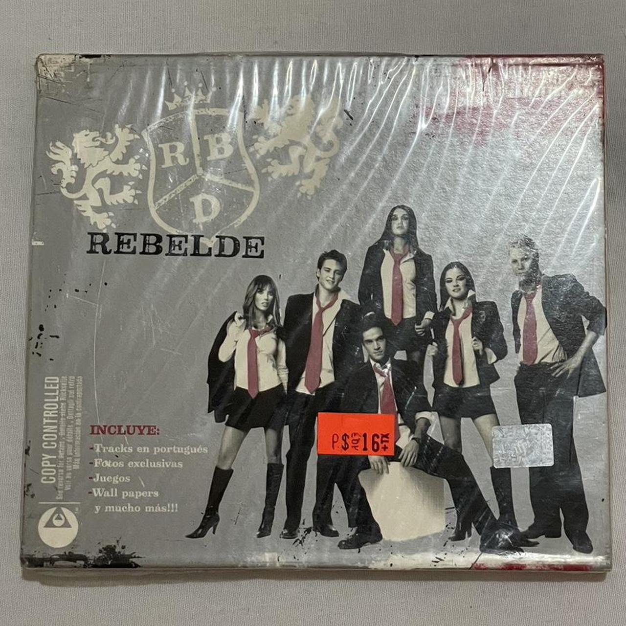 Rebelde CD 11 Songs / 11 Canciones Includes Tracks... Depop