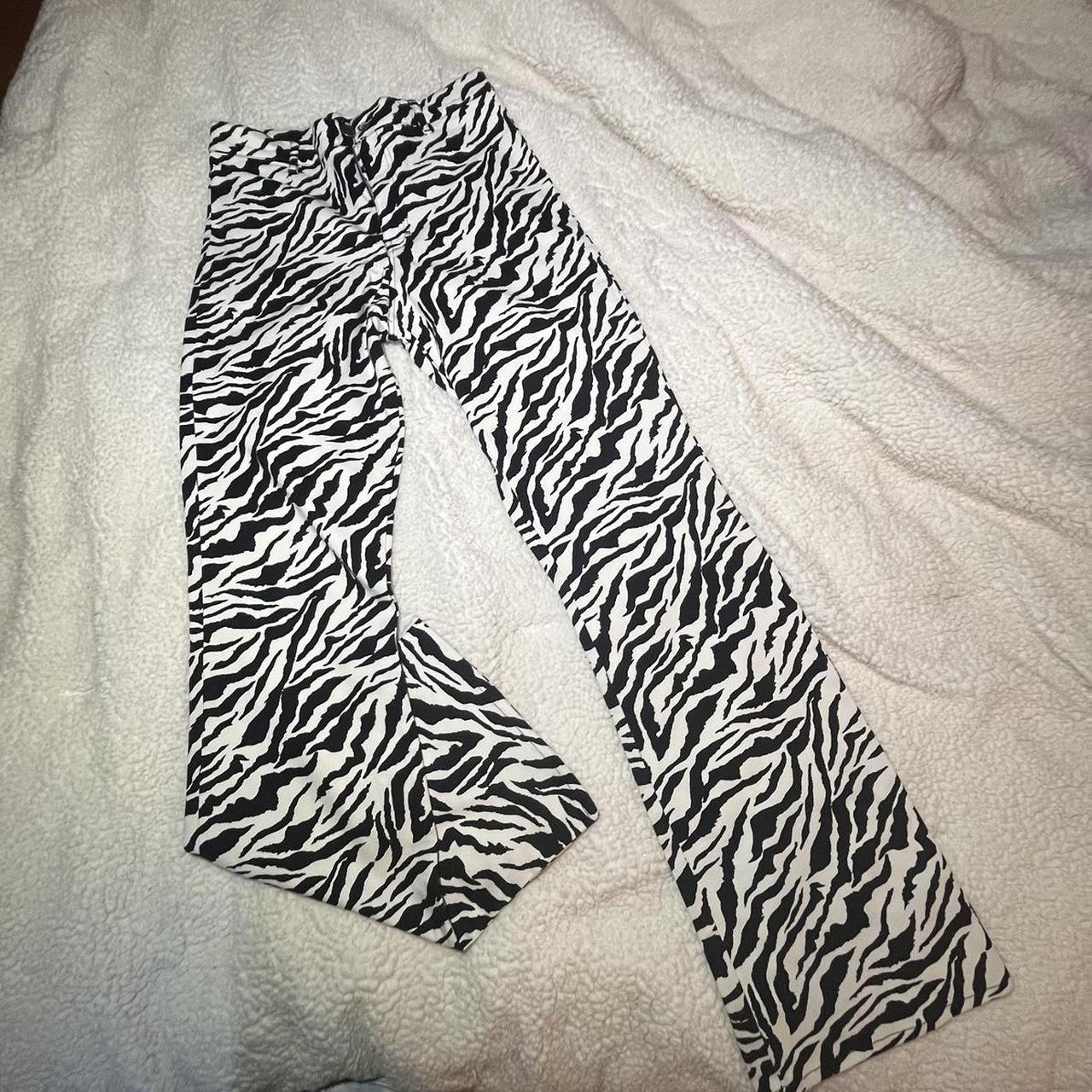 Motel Zebra print flare pants. Stretchy material and... Depop