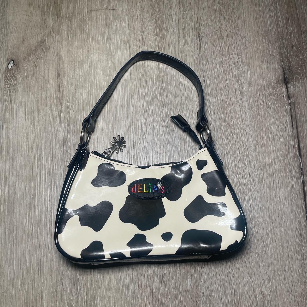 Delias cow print online purse