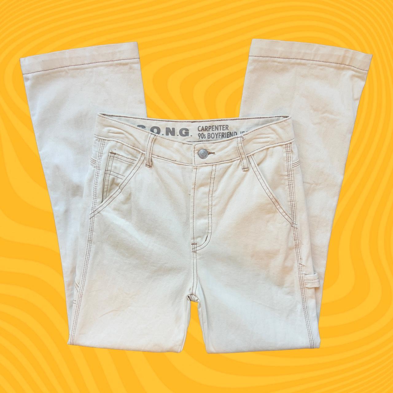 Highwaisted creamcolored cargo pants. The pants... Depop