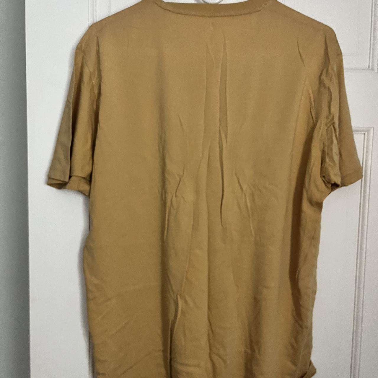 large uniqlo peach/orange tshirt, can fit an - Depop