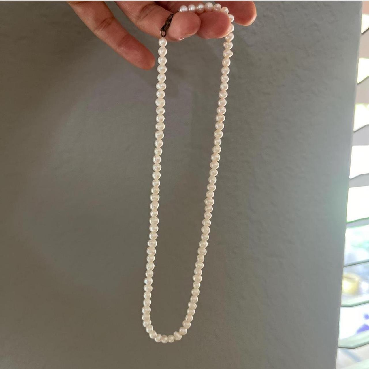 real pearl necklace. measures about 15 in total