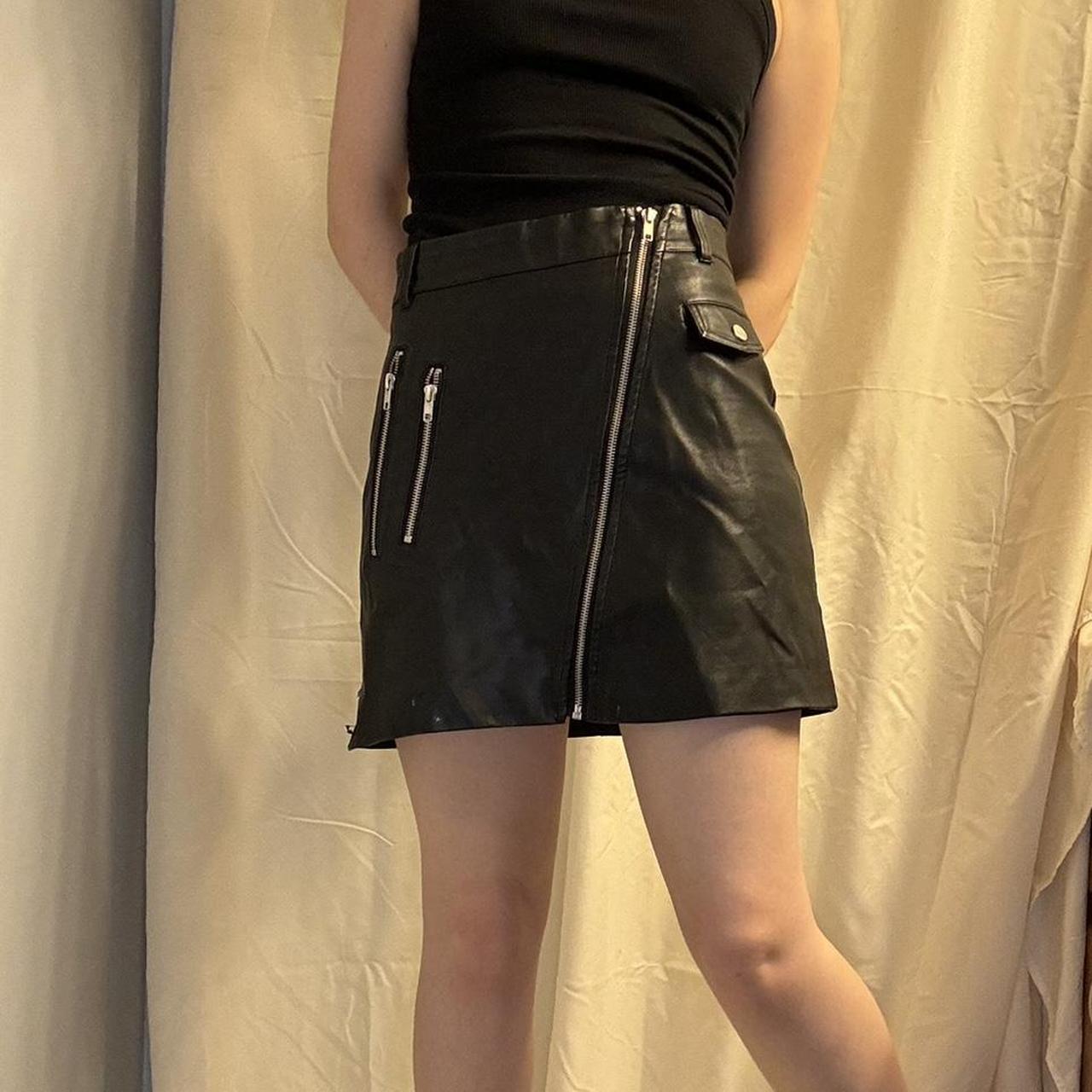 faux leather zip up mini skirt with silver. Depop