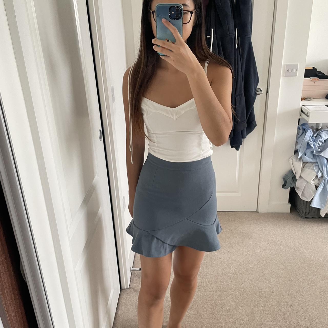 Asian branded blue mini skirt with a ruffle hem and... - Depop