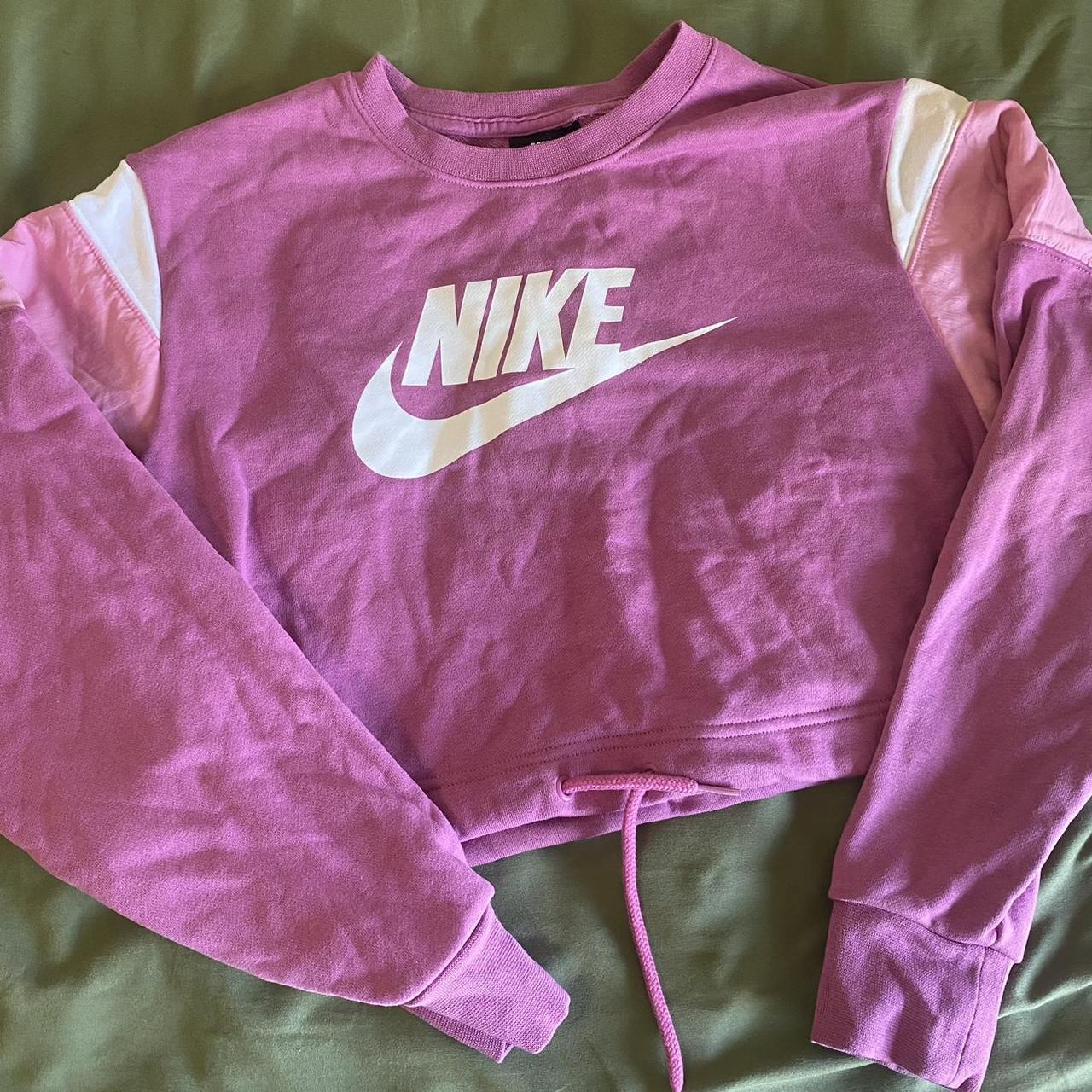 pink black and white nike shirt