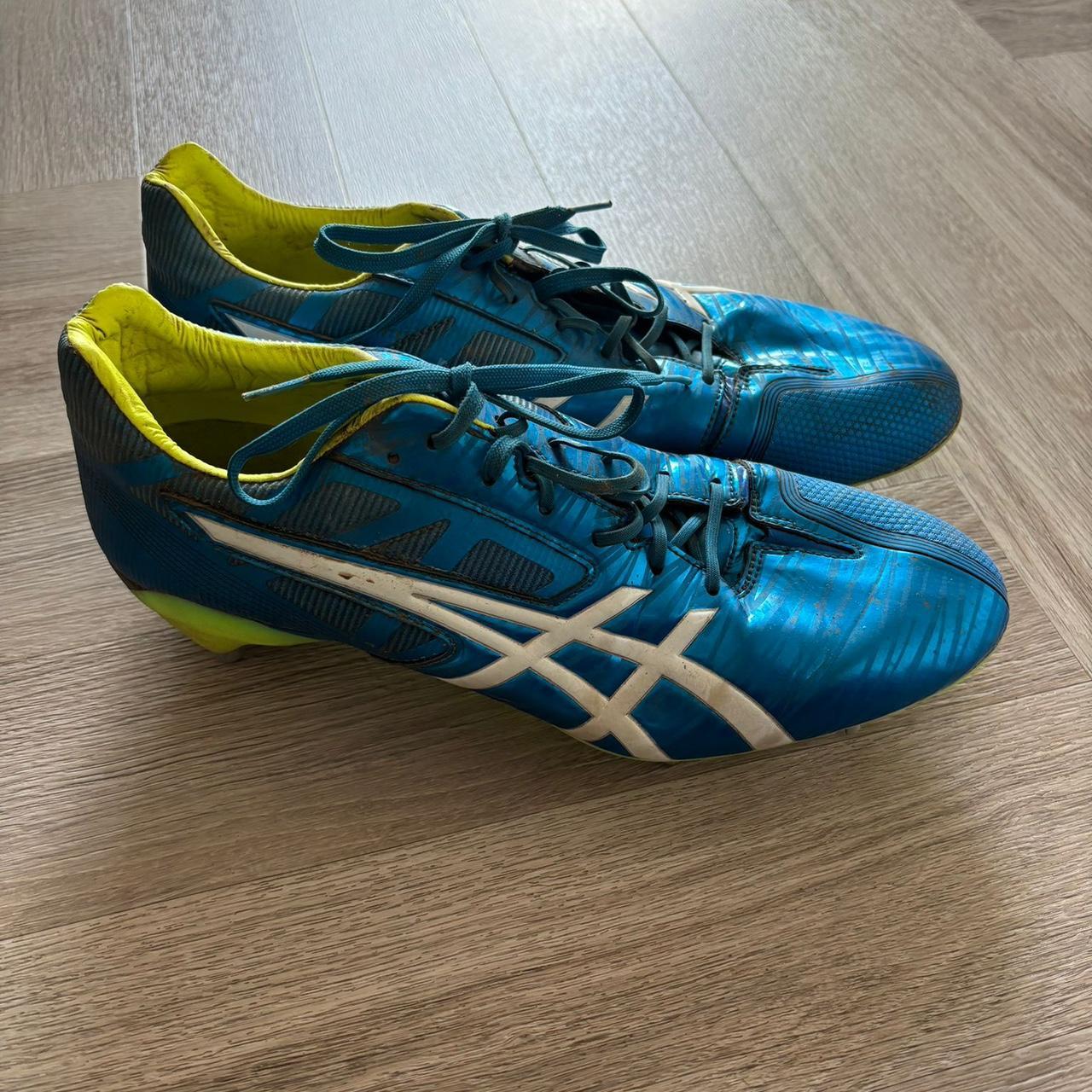 ASICS blue and yellow rugby football boots 2015. Depop