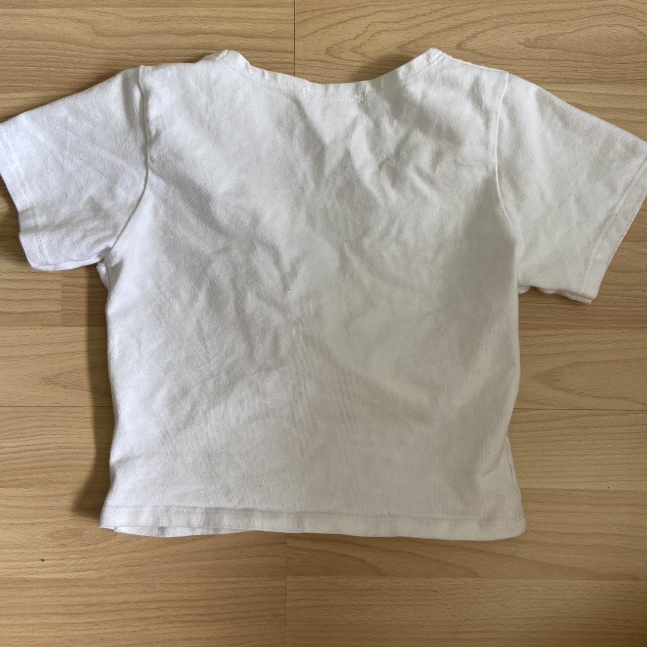 Brandy Melville white cross top Stretchy material... Depop
