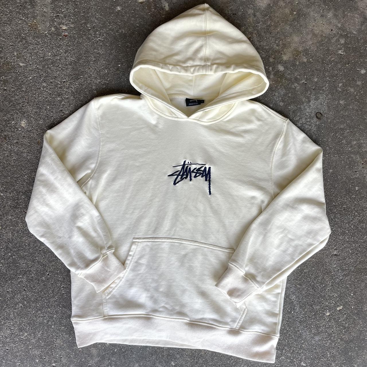 cream stussy center logo hoodie. size large fits... - Depop