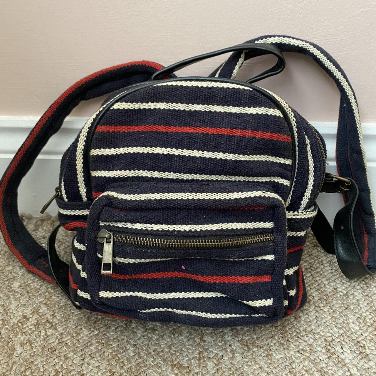 Urban Outfitters small backpack navy blue red and. Depop