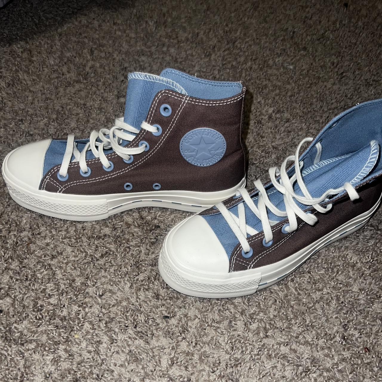 brown and blue platform converse