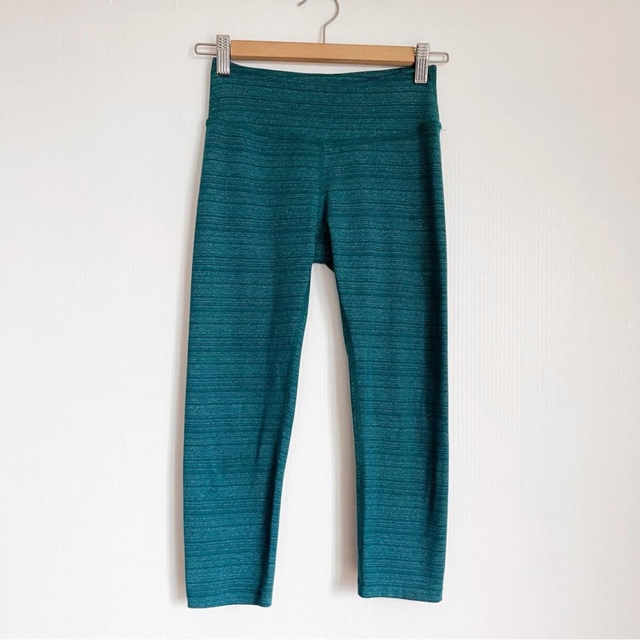 greenish teal leggings side pockets modeled on a - Depop