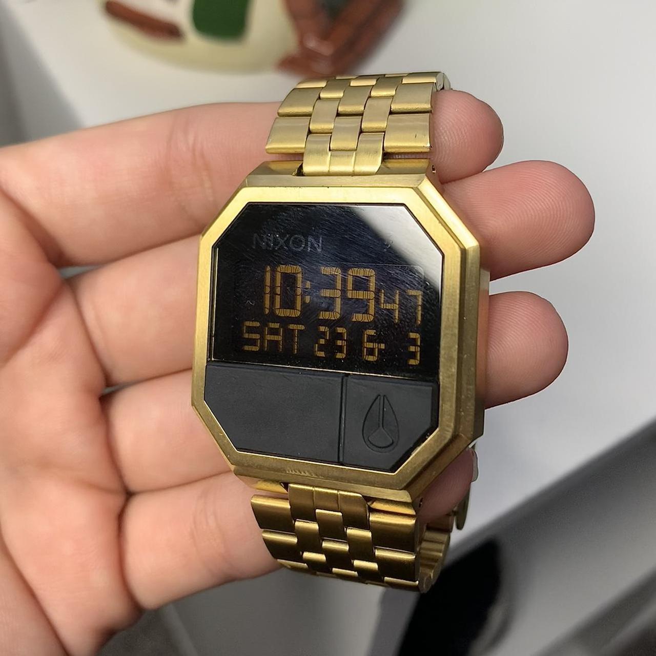 Nixon Men's Gold and Black Watch | Depop